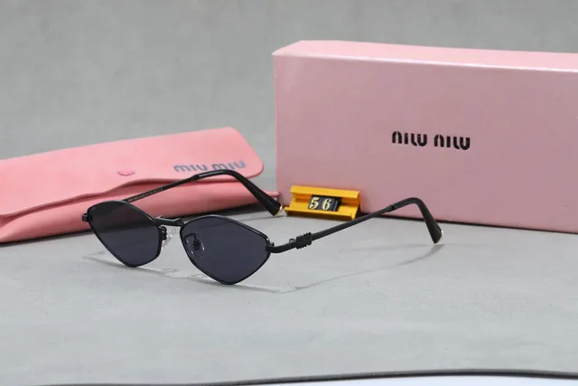 Miu Miu Cat-Eye Sunglasses Matte Black Frame with Gradient Lenses