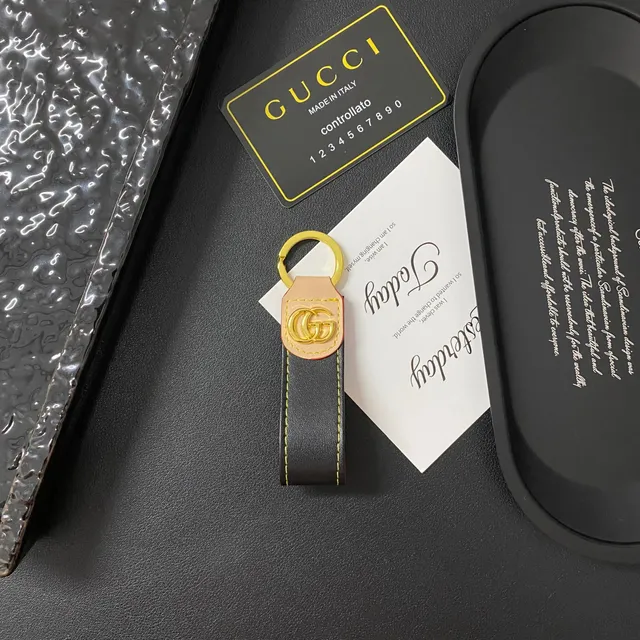 Gucci GG Leather Keychain Black and Beige with Gold Hardware