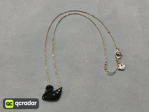Rose gold black swan necklace