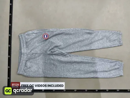 Gray pants with red label
