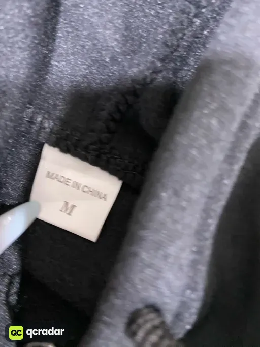 Big black heart on the back of velvet black cardigan